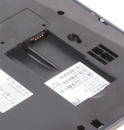 Insert the SIM card with the metal contacts facing down. Slide it into the SIM card slot.